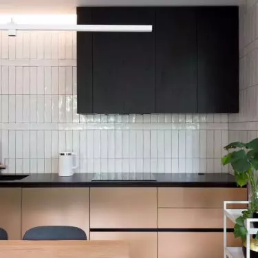 Matte furniture fronts create an intriguing contrast to glazed tiles