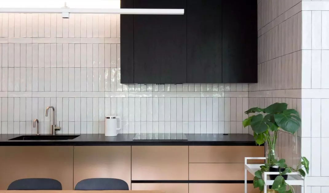 Matte furniture fronts create an intriguing contrast to glazed tiles