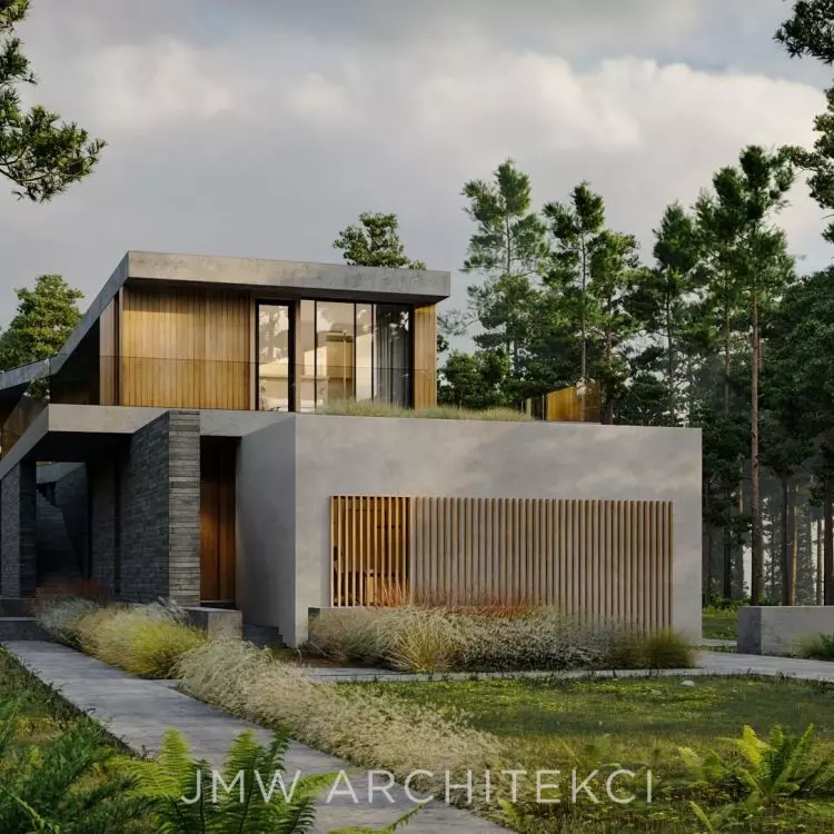 The stone block isolates the house from neighboring buildings, creating an intimate space