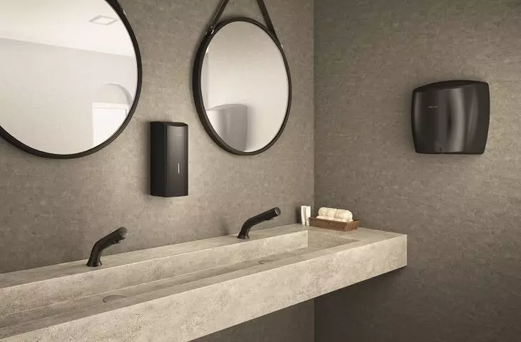 BLACK BINOPTIC low basin valve from DELABIE together with hygienic accessories