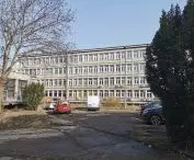 the building of the Central Refrigeration Center at 116 Juliusz Lea St.