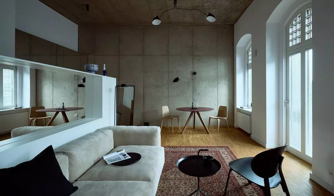 The real star of the interior is the red carpet, which breaks the minimalist restraint