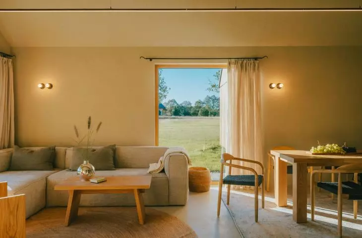 Large windows allow the landscape to penetrate inside
