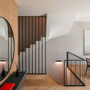 Staircase balustrades add rhythm to the whole and emphasize the geometric precision of the design