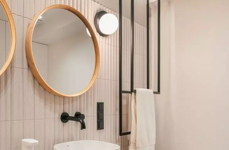 The second bathroom is kept in a light color scheme