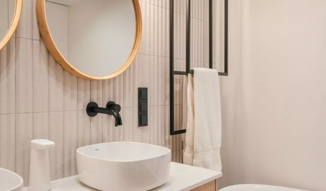 The second bathroom is kept in a light color scheme
