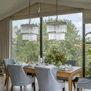 Large glass windows in the dining room allow you to dine overlooking the greenery 