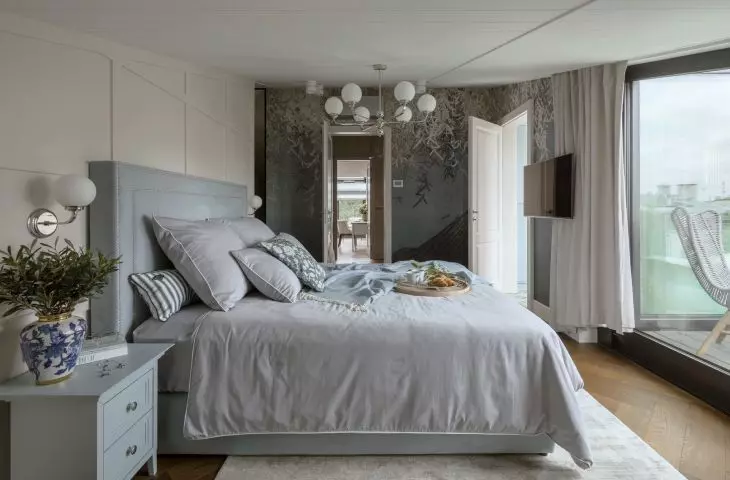 The centerpiece of the bedroom is the bed, behind which the closet was hidden 