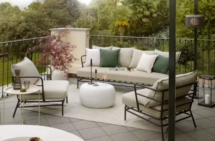 Complement the sofa in a neutral shade with subtle sage or olive-colored accents