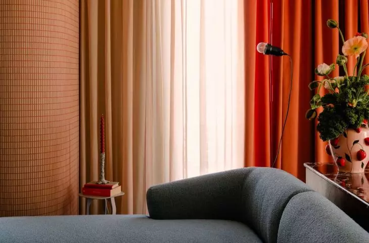 In the lounge area there is a grey corner sofa