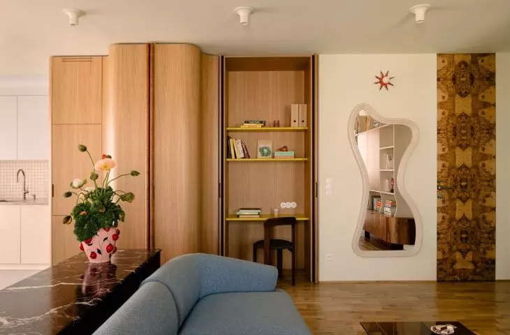 The oak cabinetry hides a place to work