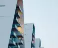 The Wave apartment complex in Vejle, Denmark - the side elevations of the towers are smooth and vertical, dominated by large-format glazing