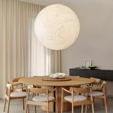 Above the dining table hangs the unique Moon lamp by Davide Groppi