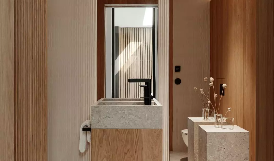 The interior combines modern architecture with the warmth of natural materials
