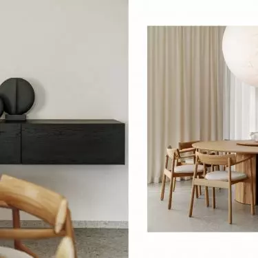 The black cabinet provides a strong counterpoint to the soft arrangement