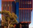 The facade of the building was built with two main materials: glass and red lamellas