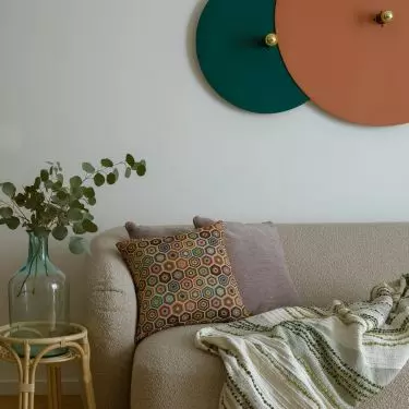 The living room serves several functions at once - it is a place for relaxation, a dining room, a kitchen, as well as a work space 