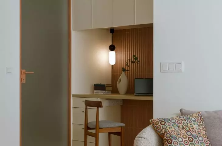 Hidden behind the desk is a dressing room, accessed from the bedroom 