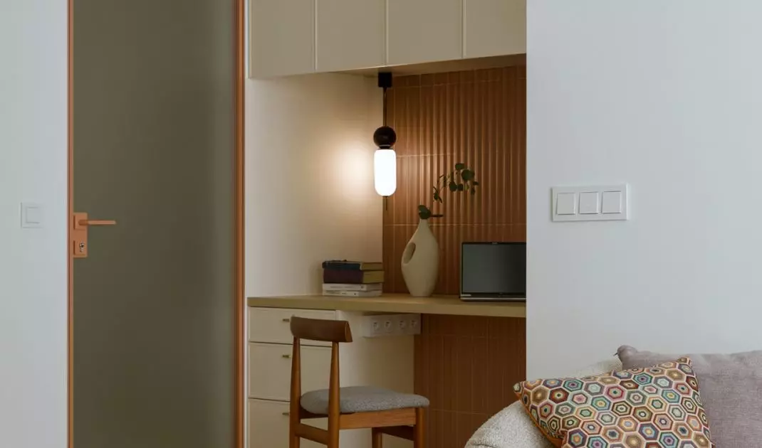 Hidden behind the desk is a dressing room, accessed from the bedroom 