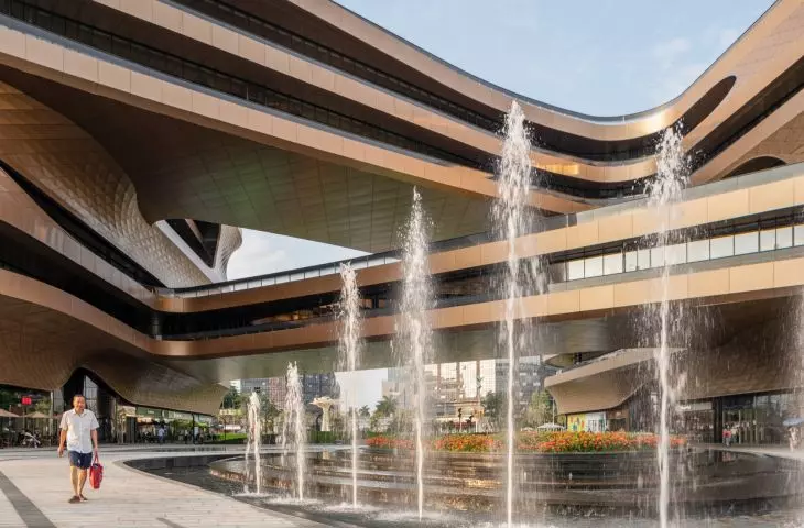Infinitus Plaza in Guangzhou - bridges with gentle curves connecting the two segments of the edifice wind in a dynamic manner