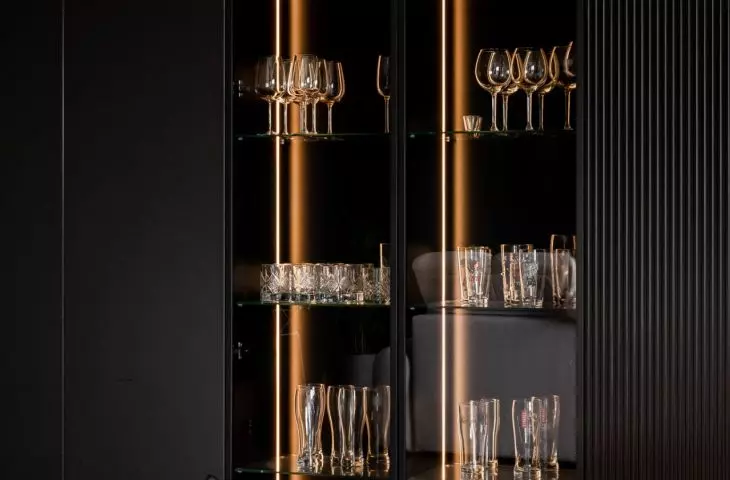 A balanced composition of dark colors, noble materials and soft light creates an interior full of calm and elegance