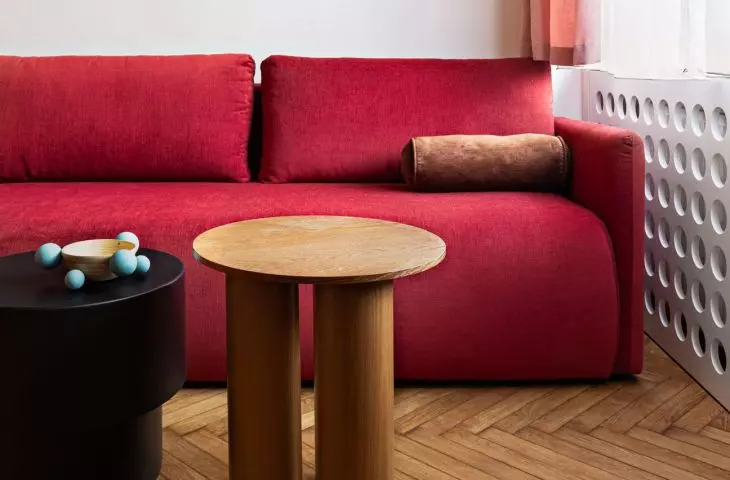 The sofa in the living room also functions as a bed