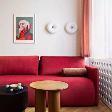 The sofa in the living room also functions as a bed