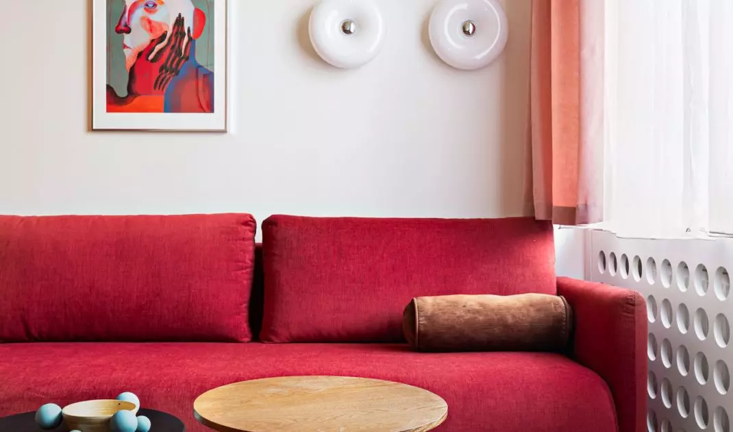 The sofa in the living room also functions as a bed