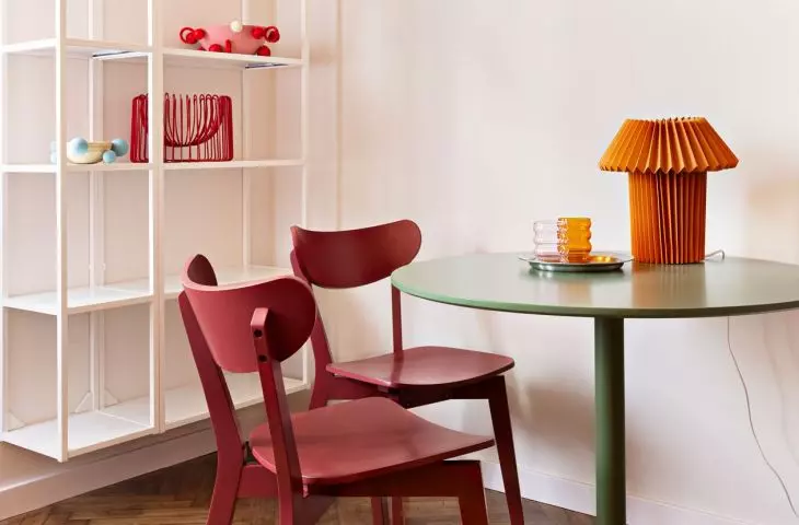 Above the table hung works by artist Carla Petelski
