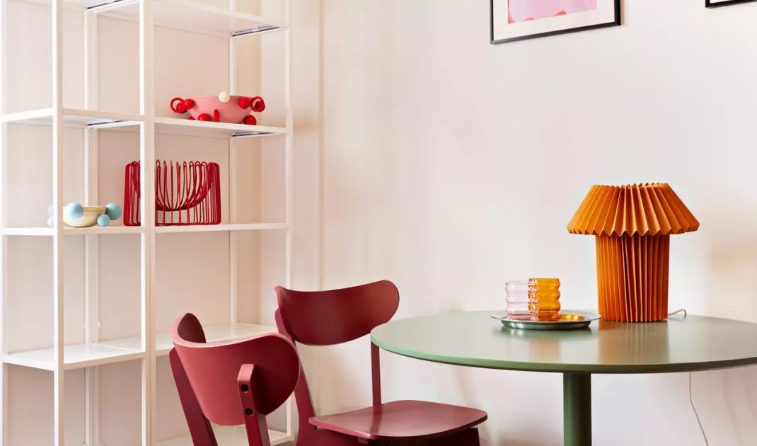 Above the table hung works by artist Carla Petelski