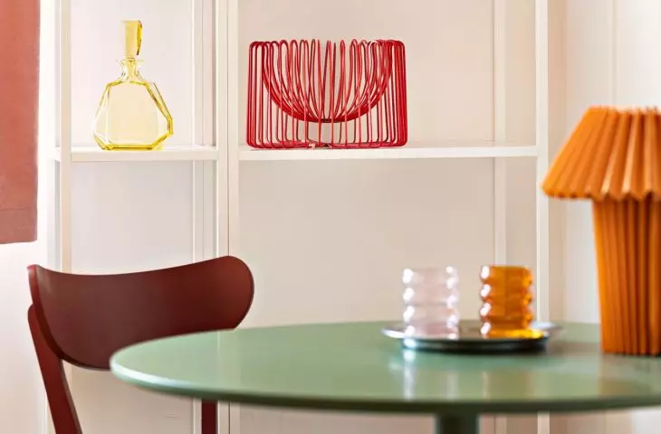 Colorful glass, bowls with spherical forms and fancy lamps complete this unique arrangement