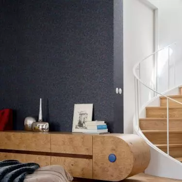 The 150-square-meter interior is located on the top floor of a revitalized building