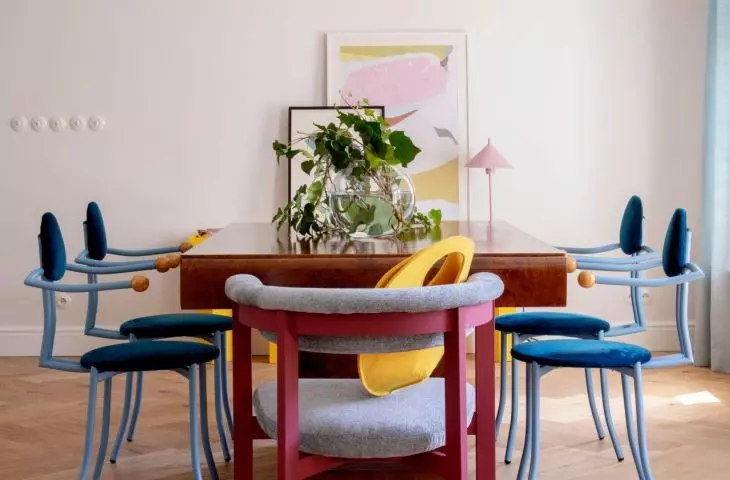 Dining room with a massive table and chairs of original form