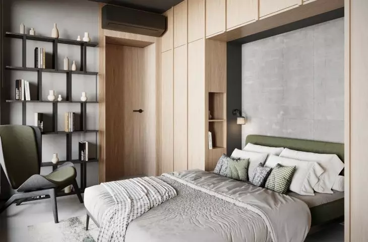 In the second bedroom, the architects opted for a juxtaposition of loft elements with lots of light wood