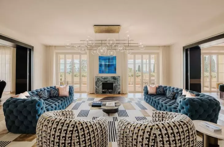 Sofas in a saturated, refined shade of blue provide a distinctive accent