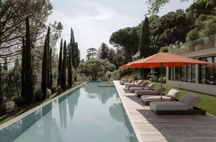 Cottage opens to pool and teak terrace