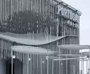 The pavilion was created from recycled materials such as fishing nets, which together with suspended ropes create a light and dynamic structure