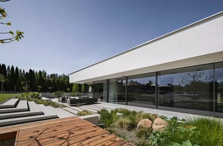 Minimalist architecture of a single-family single-storey house near Lublin with full-height glazing