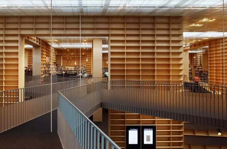 Interior view of Sou Fujimoto's Spiral Library - monumental bookcases create a labyrinth of knowledge in the heart of Gunma