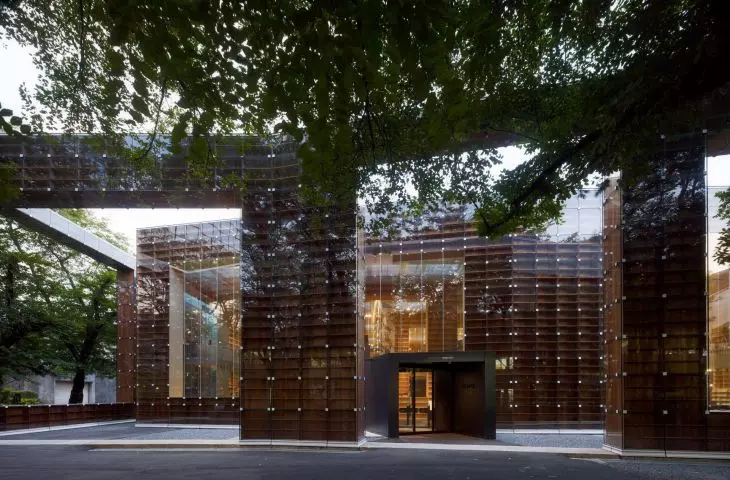 Modern wood and glass library - a space designed like a bookcase that absorbs visitors