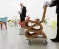 a chair designed by Frank Gehry. Wiggle Side Chair is a piece of furniture made of corrugated cardboard