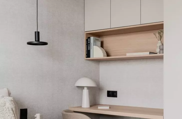The bedroom also has a desk hidden in an alcove