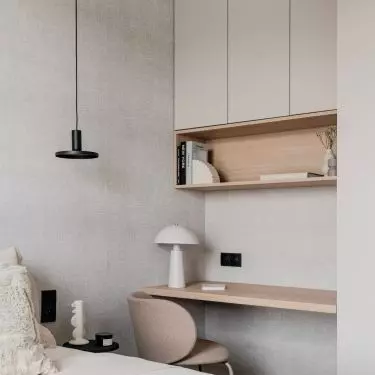 The bedroom also has a desk hidden in an alcove