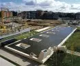 General view of the sheet of water on the surface of the building, which acts as a roof - a mirror reflecting the sky of León