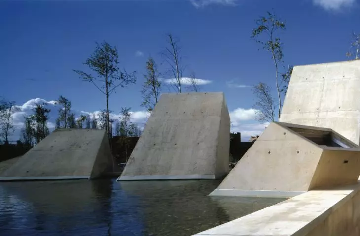 Architectural skylights piercing through the plane of water - elements that illuminate underground spaces and introduce the symbolism of the 