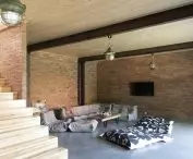 First floor of house with preserved original brick on walls