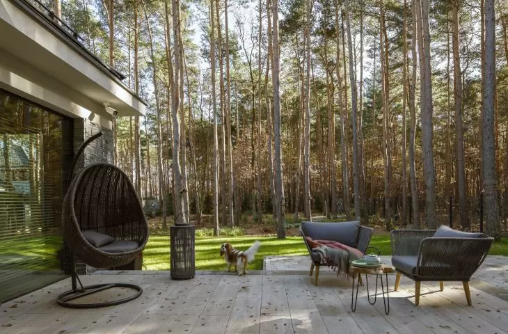 The villa by Hola Design studio in the Młociński Forest features terraces that encourage people to get out into the fresh air