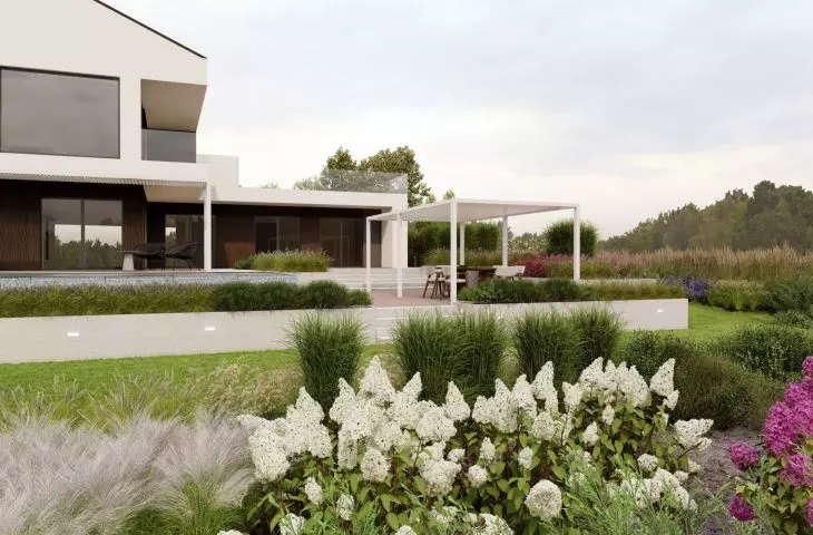 Modern body of the house against the background of a green garden