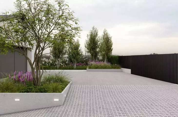 Ornamental trees appeared in the area of the main entrance to the house and the garage entrance