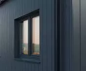 Cedral Click Smooth fiber-cement boards on the facade of a frame house